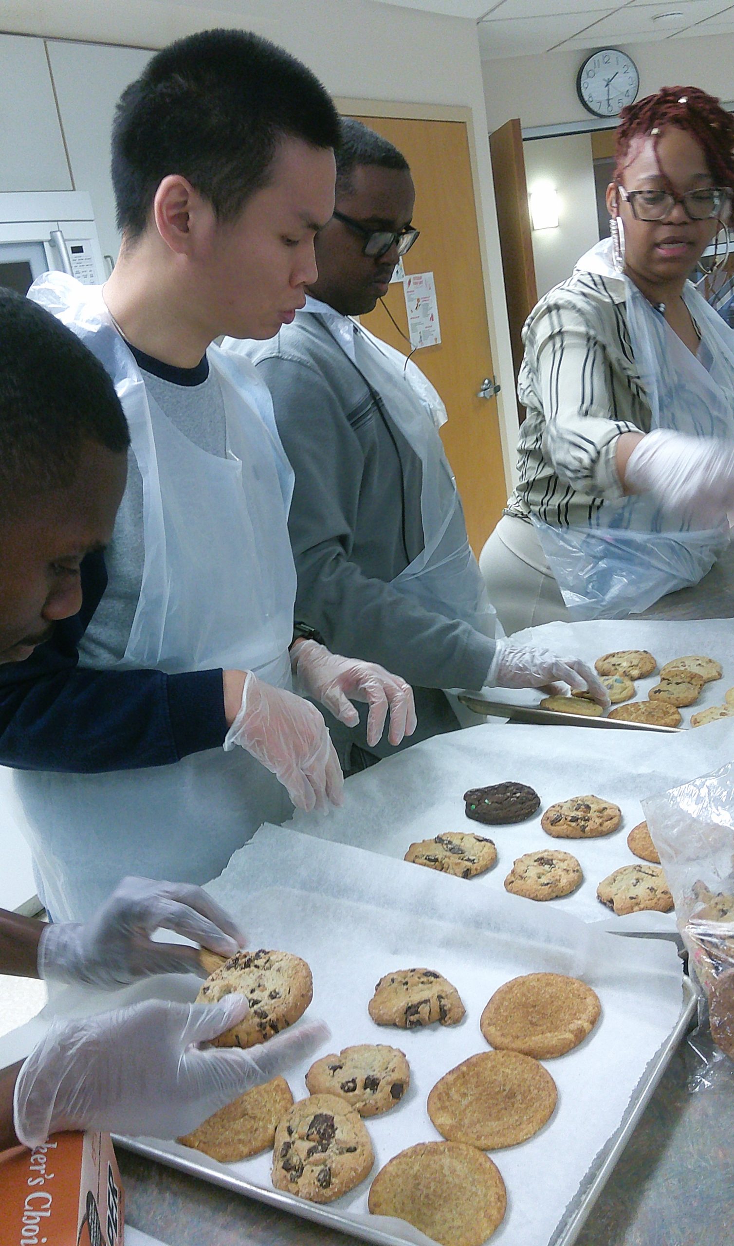Participants actively working with cookies during a Culinary Arts Classroom activity